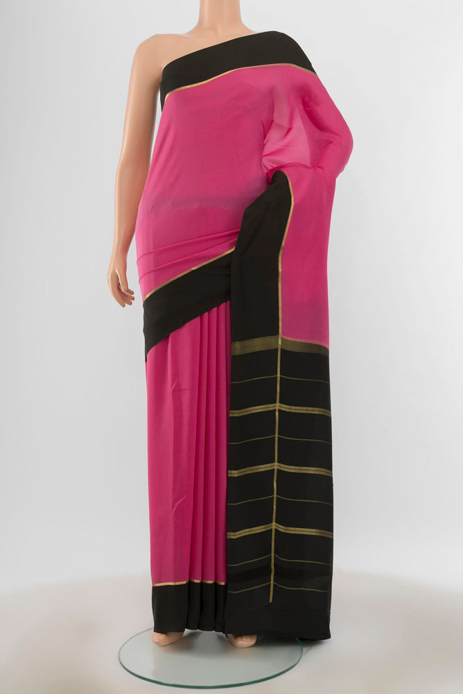 Pure Silk Pure Zari Bronze Mysore Crepe Saree with Zari Butta on the body and Silk Border.  displayed on a mannequin