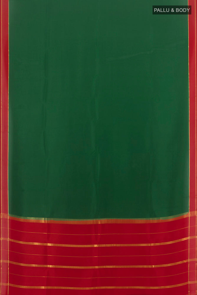 Flat view of Pure Silk Pure Zari Bottle Green Mysore Crepe Saree with Zari Butta on the body and Silk Border. 