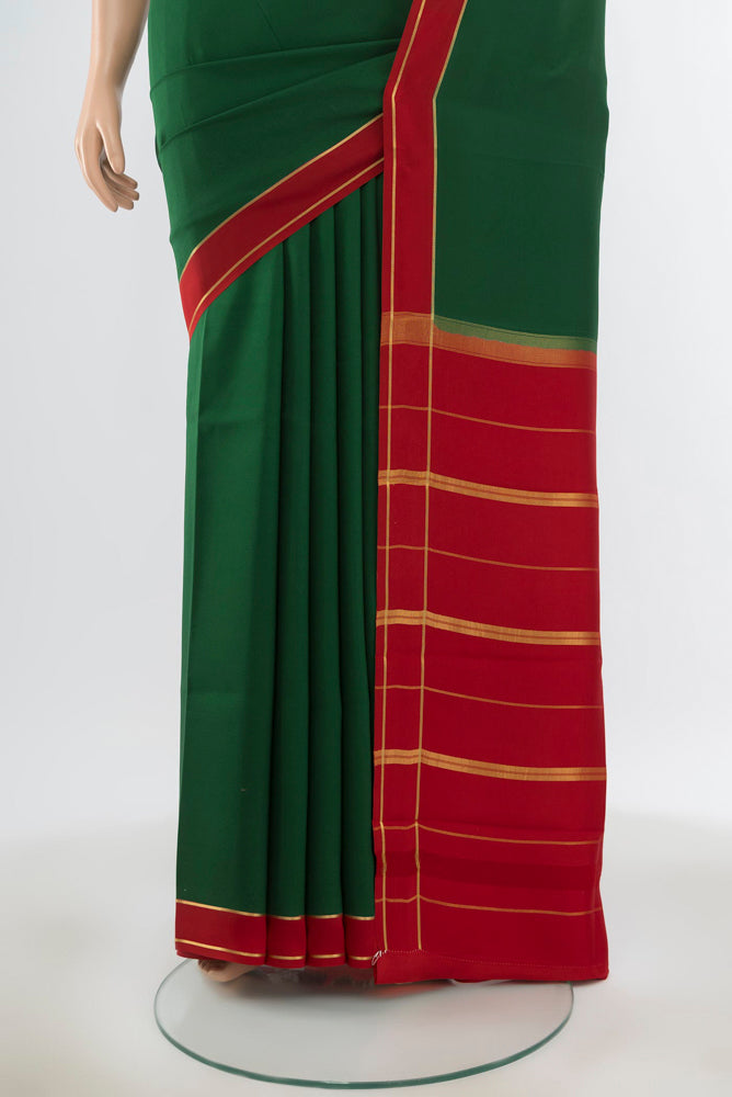 Pleats and pallu of Pure Silk Pure Zari Bottle Green Mysore Crepe Saree with Zari Butta on the body and Silk Border. 