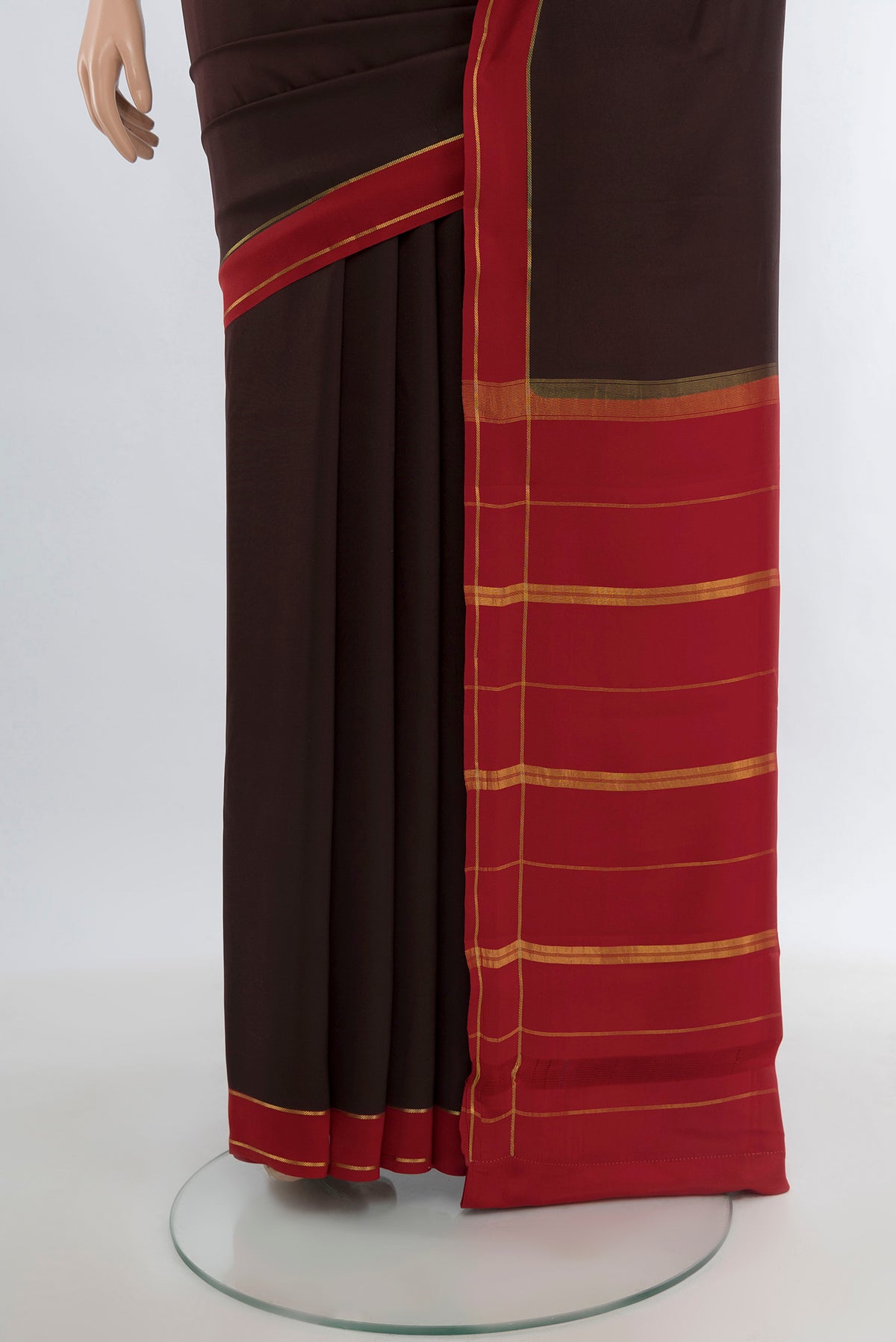 Pleats and pallu of Pure Silk Pure Zari Coffee Brown Mysore Crepe Saree with Plain Body and Rising Temple Border. 