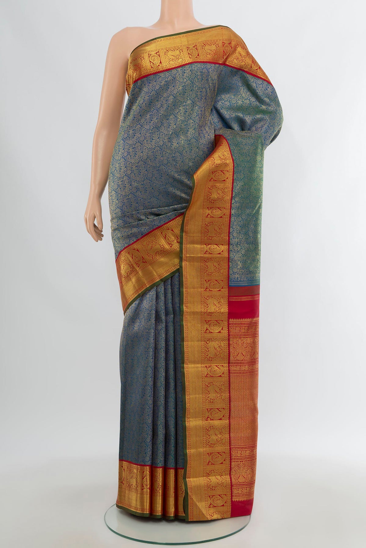 Pure Silk Pure Zari Blue Kanjivaram Saree with Zari Brocade on the body and Zari Border.  displayed on a mannequin