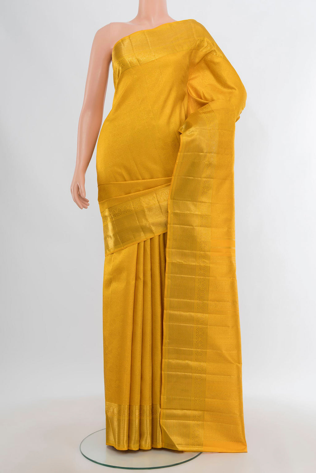 Pure Silk Pure Zari Yellow Kanjivaram Saree with Zari Brocade on the body and Zari Border.  displayed on a mannequin