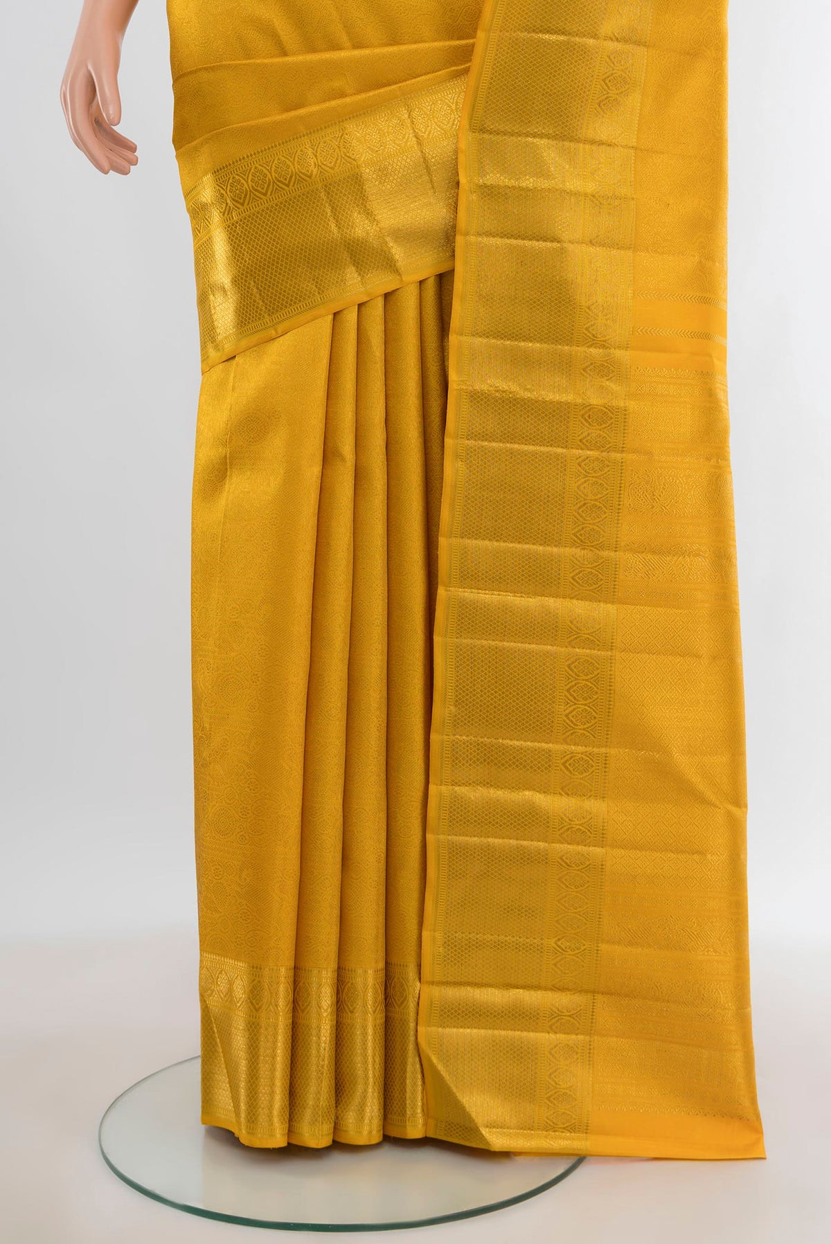 Pleats and pallu of Pure Silk Pure Zari Yellow Kanjivaram Saree with Zari Brocade on the body and Zari Border. 