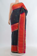 Pure Silk Pure Zari Multi Color Kanjivaram Saree with Zari Butta on the body and Zari Border.  displayed on a mannequin