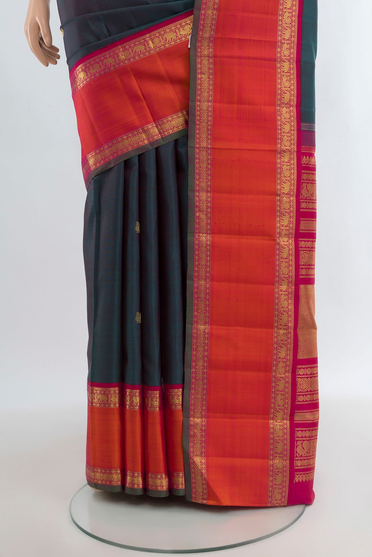 Pleats and pallu of Pure Silk Pure Zari Multi Color Kanjivaram Saree with Zari Butta on the body and Zari Border. 