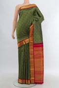 Pure Silk Pure Zari Bottle Green Kanjivaram Saree with Zari Brocade on the body and Zari Border.  displayed on a mannequin