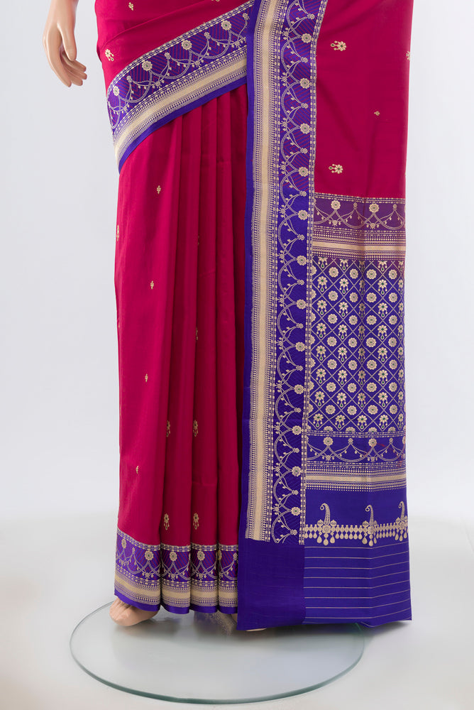 Pleats and pallu of Maroon Banarasi Katan Silk Saree with Zari Butta on the body and Silk Border. 