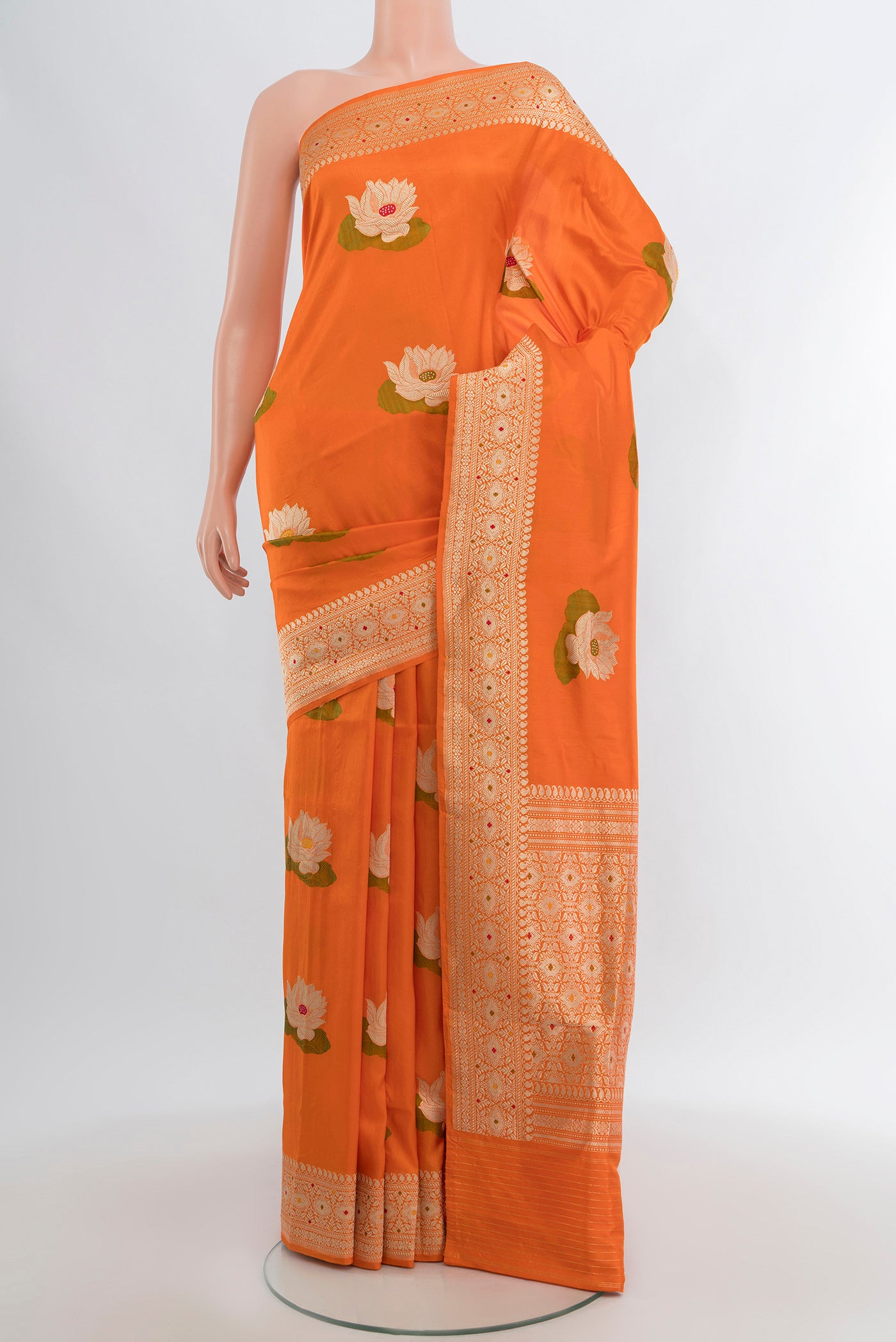 Orange Banarasi Silk Saree with Zari And Thread Butta on the body and Zari Border.  displayed on a mannequin