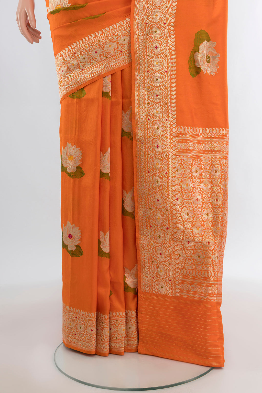 Pleats and pallu of Orange Banarasi Silk Saree with Zari And Thread Butta on the body and Zari Border. 