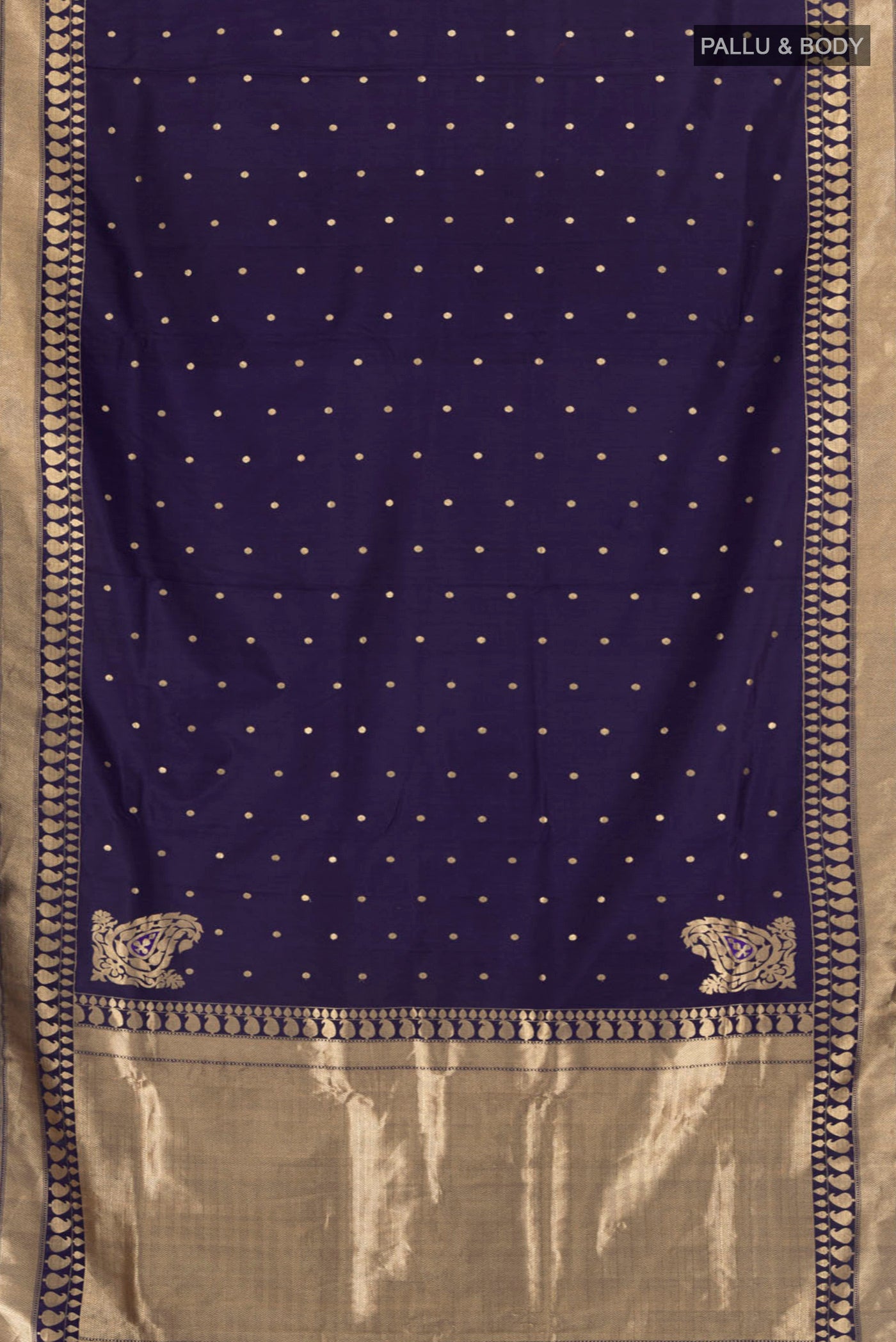 Flat view of Navy Blue Banarasi Silk Saree with Zari Butta on the body and Zari Border. 