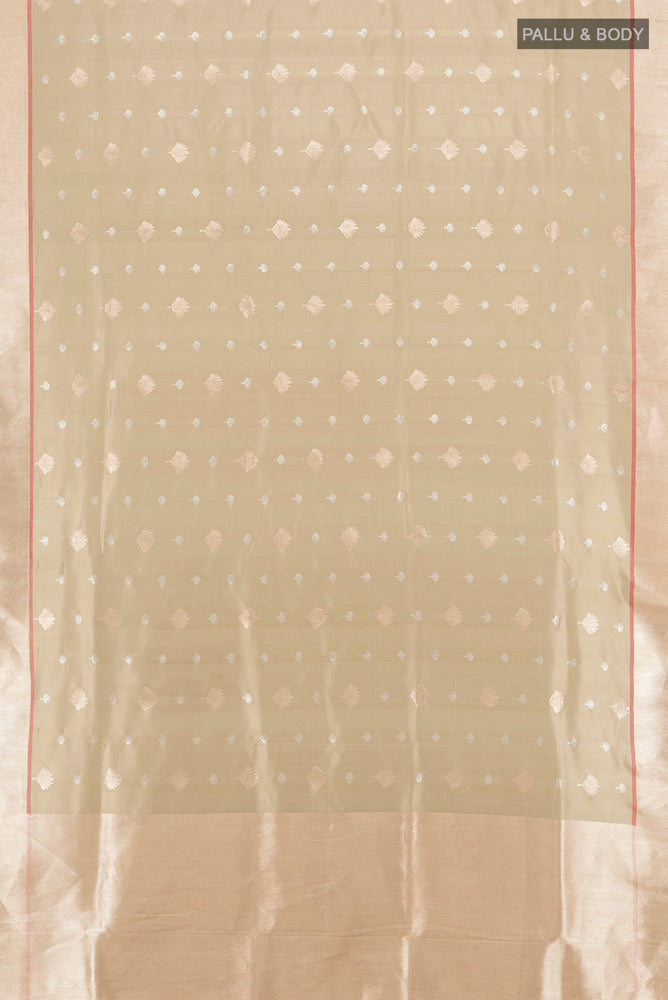 Flat view of Beige Banarasi Katan Silk Saree with Zari Butta on the body and Silk Border. 