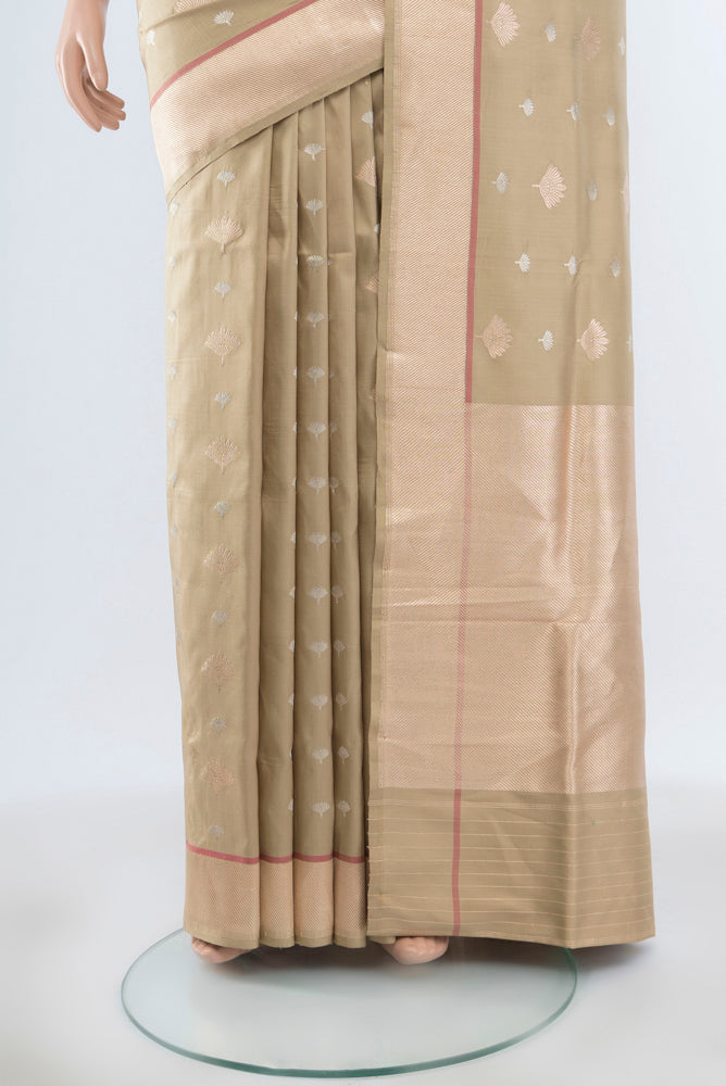 Pleats and pallu of Beige Banarasi Katan Silk Saree with Zari Butta on the body and Silk Border. 