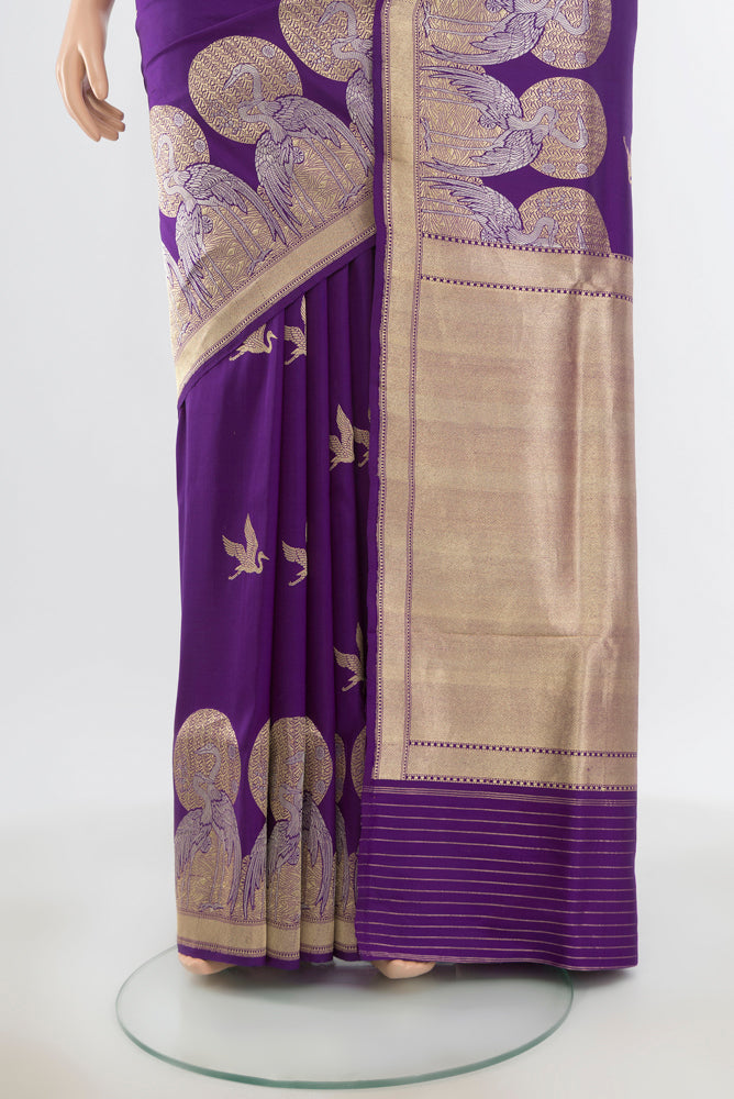Pleats and pallu of Pure Silk Pure Zari Violet Banarasi Katan Saree with Zari Butta on the body and Silk Border. 