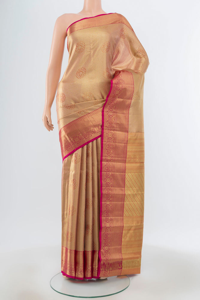 Pure Silk Pure Zari Golden Kanjivaram Saree with Zari Butta on the body and Silk Border.  displayed on a mannequin