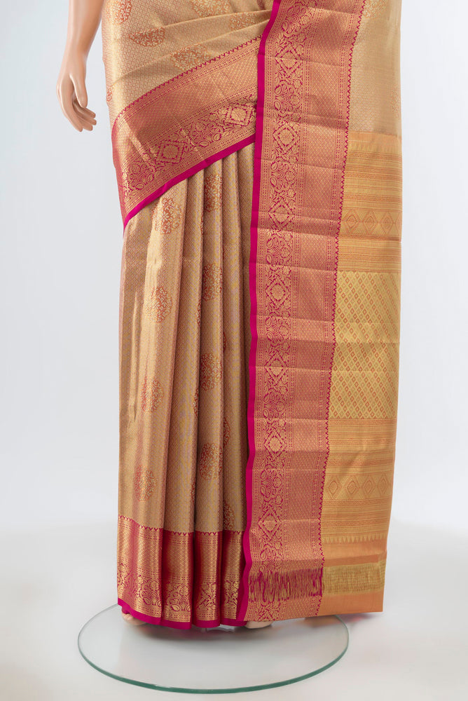 Pleats and pallu of Pure Silk Pure Zari Golden Kanjivaram Saree with Zari Butta on the body and Silk Border. 