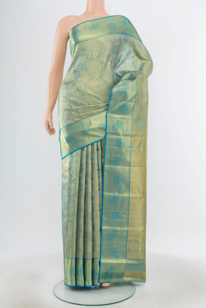 Pure Silk Pure Zari Golden Kanjivaram Saree with Zari Butta on the body and Silk Border.  displayed on a mannequin