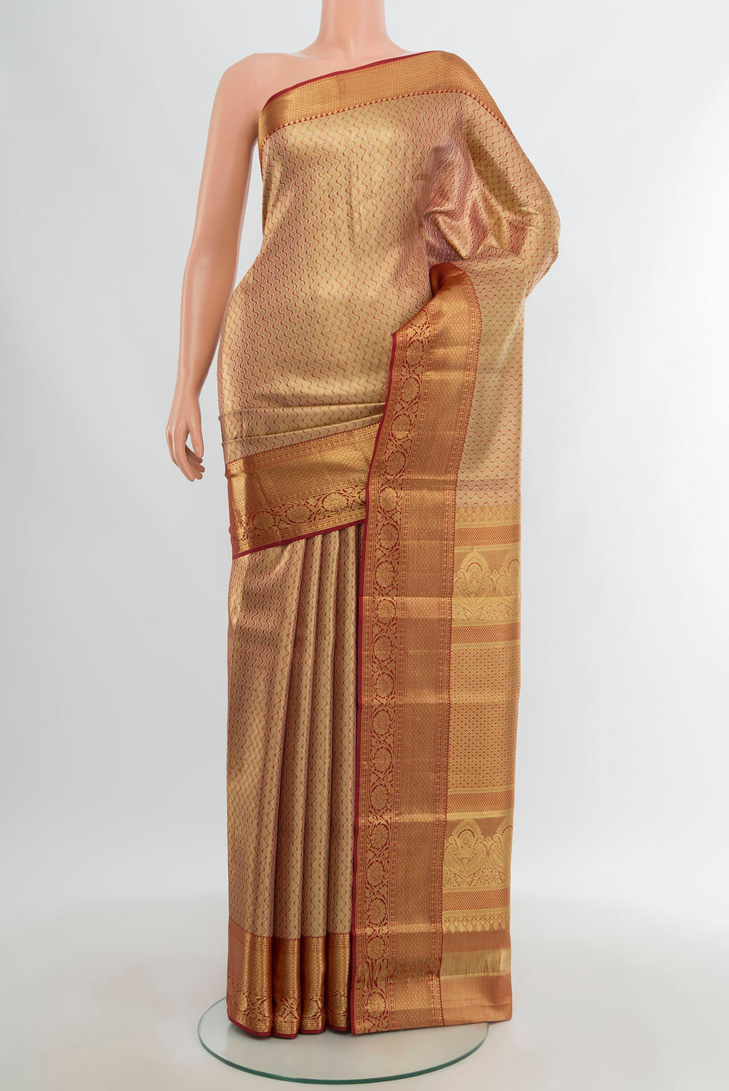 Golden Kanjivaram Tissue Silk Saree with Zari Brocade on the body and Zari Border.  displayed on a mannequin