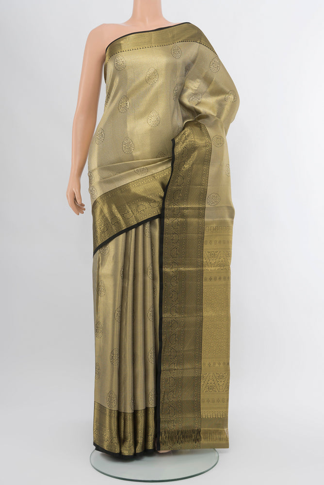 Golden Kanjivaram Silk Saree with Zari Butta on the body and Silk Border.  displayed on a mannequin