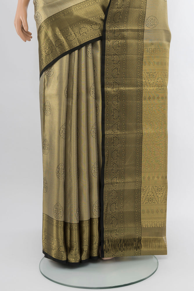 Pleats and pallu of Golden Kanjivaram Silk Saree with Zari Butta on the body and Silk Border. 