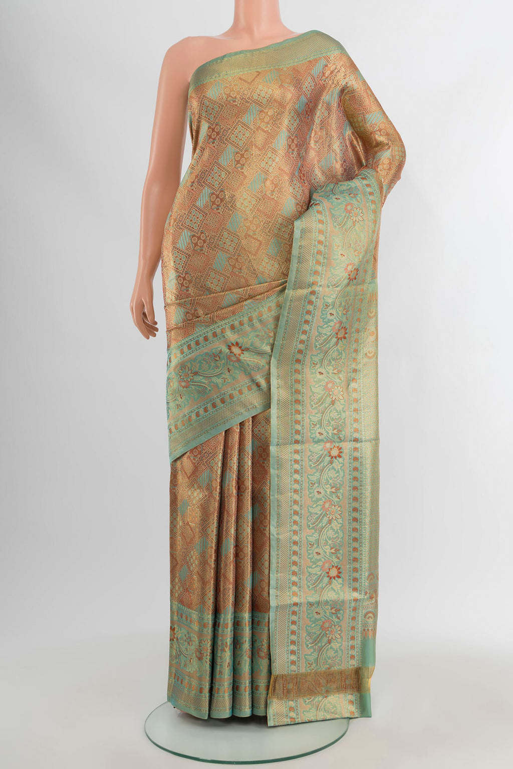 Golden Kanchipuram Tissue Silk Saree with Zari Brocade on the body and Zari Border.  displayed on a mannequin
