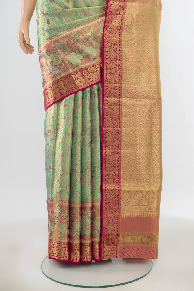 Pleats and pallu of Pure Silk Pure Zari Pista Green Kanchipuram Saree with Zari Butta on the body and Silk Border. 