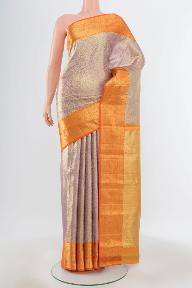 Pure Silk Pure Zari Lavender Kanchipuram Saree with Zari Butta on the body and Silk Border.  displayed on a mannequin