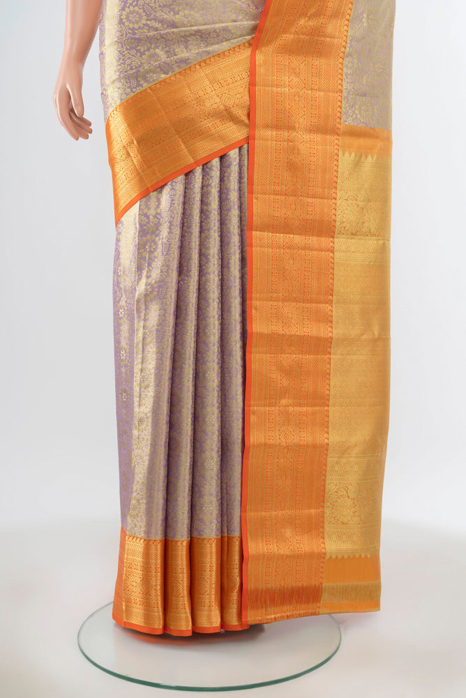 Pleats and pallu of Pure Silk Pure Zari Lavender Kanchipuram Saree with Zari Butta on the body and Silk Border. 