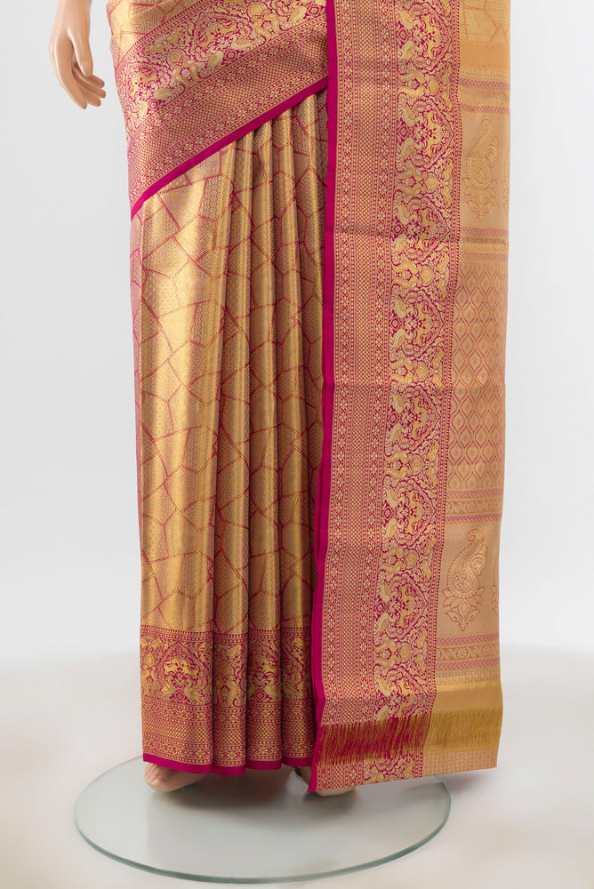 Pleats and pallu of Golden Peach Kanchipuram Silk Saree with Zari Brocade on the body and Silk Border. 