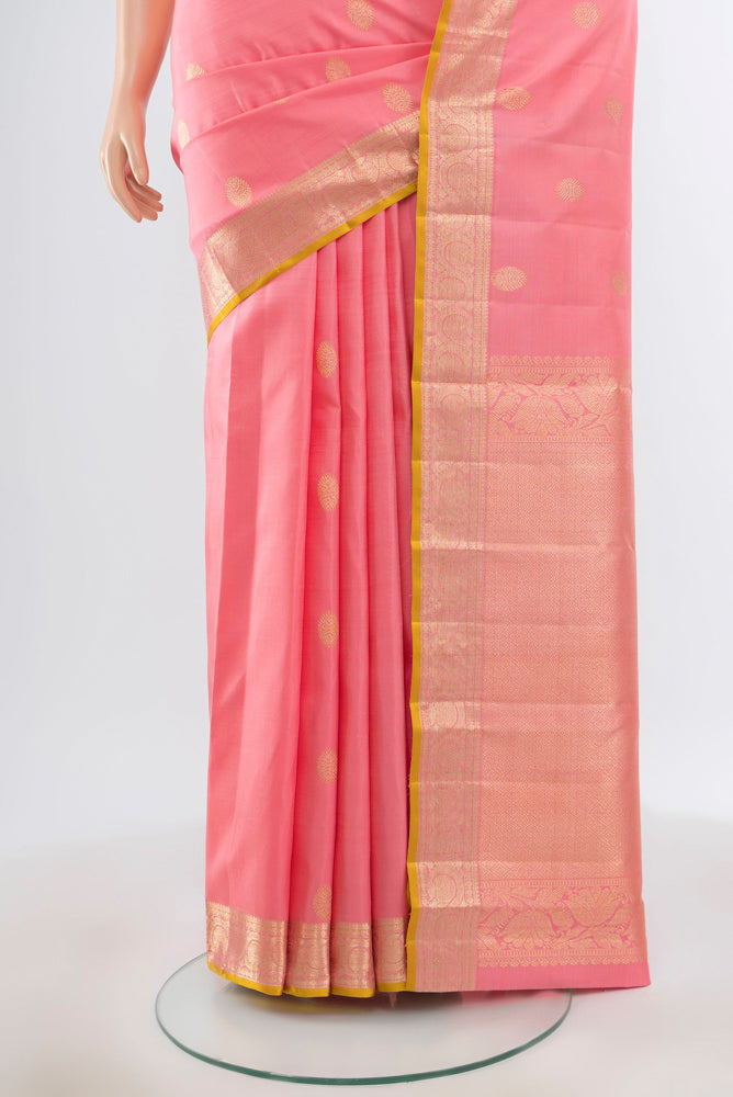 Pleats and pallu of Pure Silk Pure Zari Rose Gold Kanjivaram Saree with Zari Butta on the body and Silk Border. 