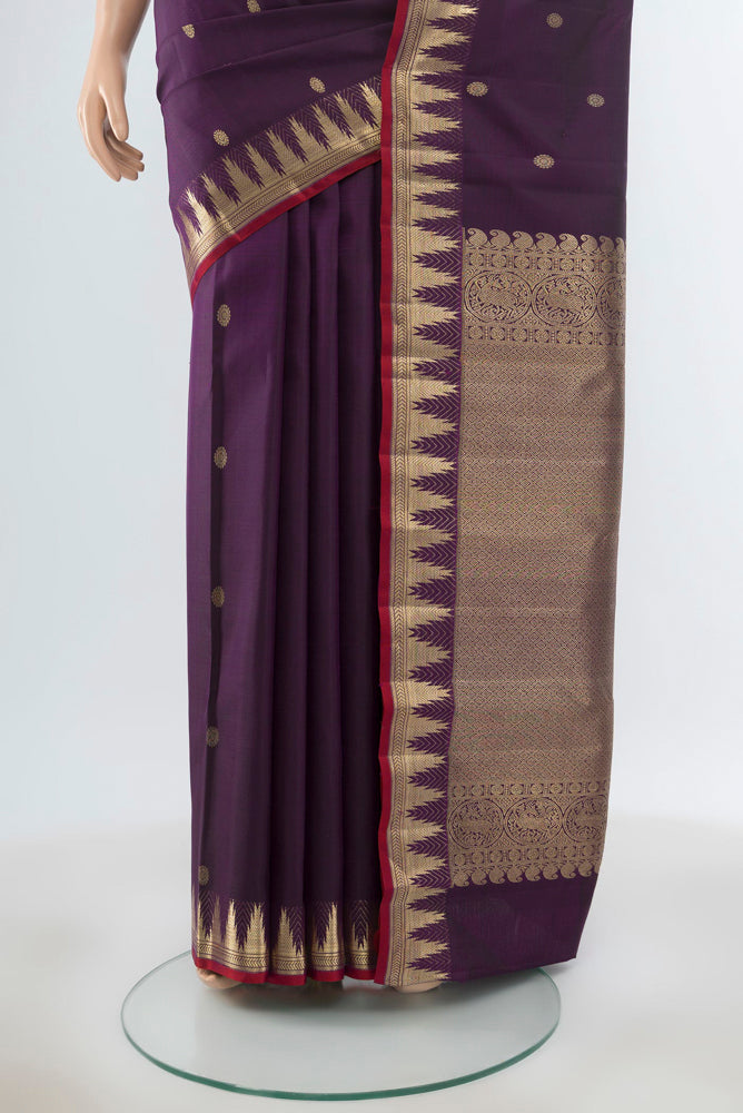 Pleats and pallu of Pure Silk Pure Zari Violet Kanjivaram Saree with Zari Butta on the body and Silk Border. 