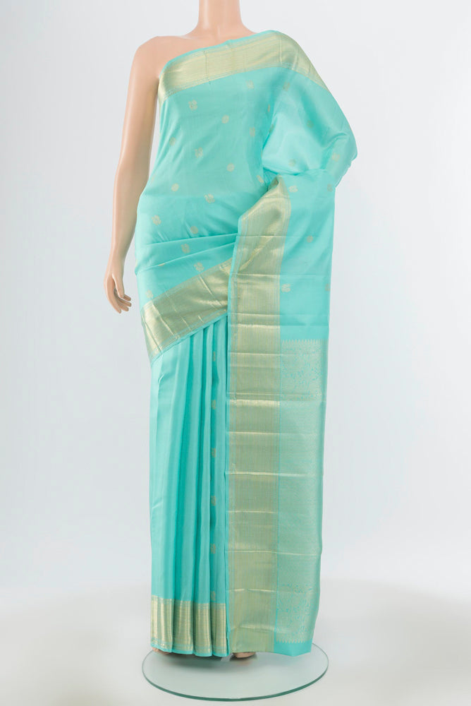 Pure Silk Pure Zari Sky Blue Kanjivaram Saree with Zari Butta on the body and Silk Border.  displayed on a mannequin