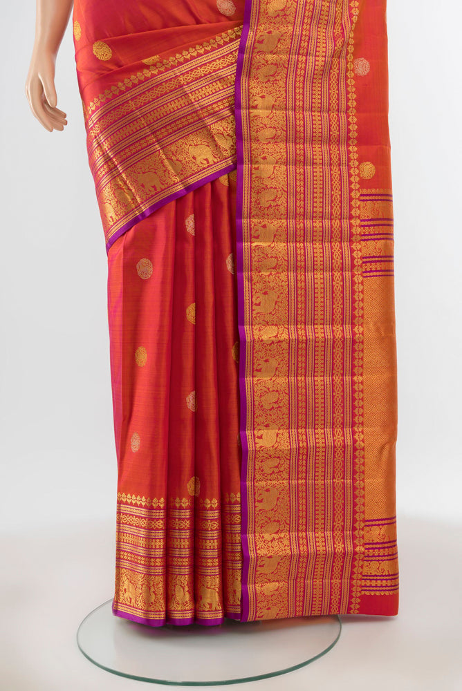 Pleats and pallu of Pure Silk Pure Zari Peach Kanjivaram Saree with Zari Butta on the body and Silk Border. 