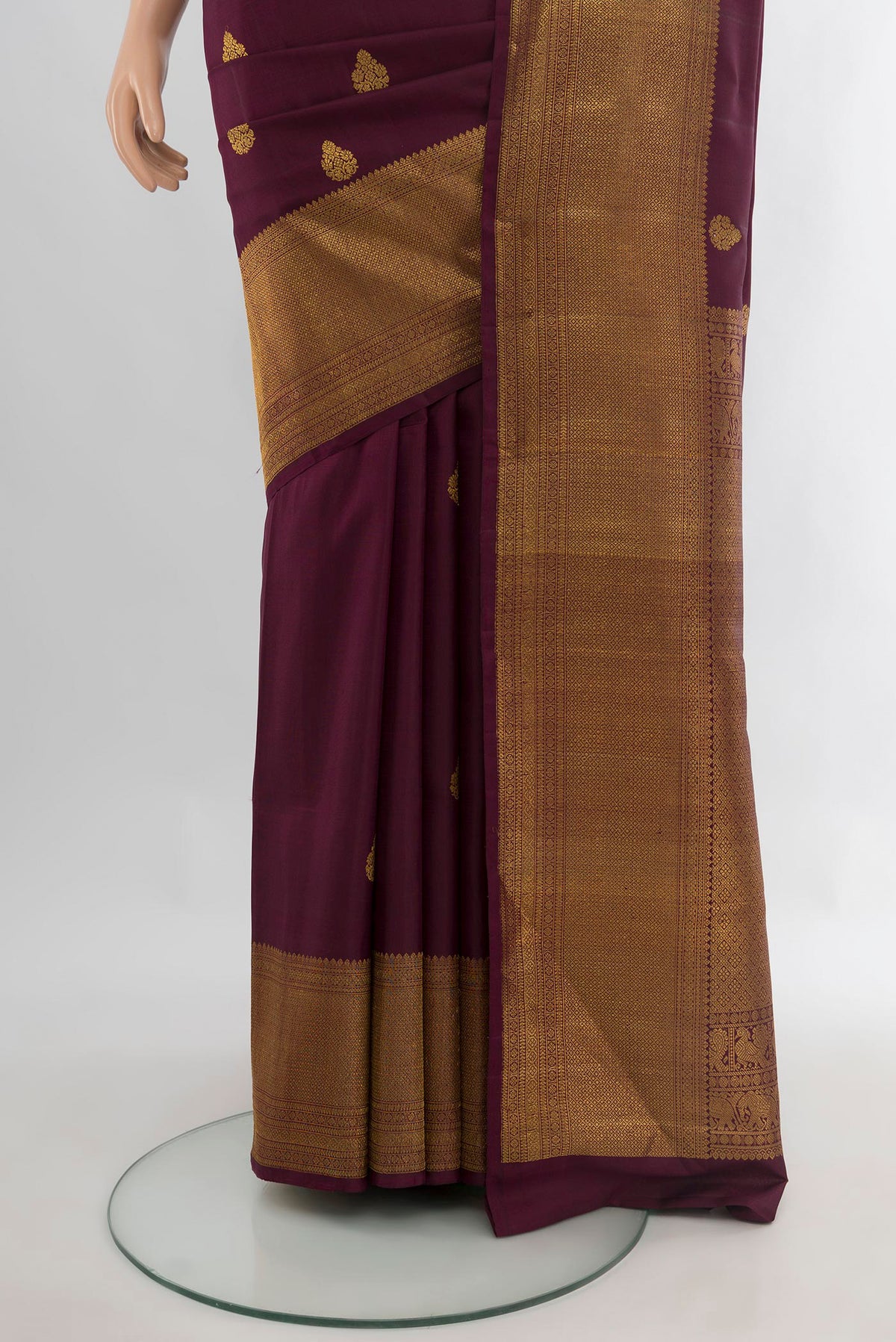 Pleats and pallu of Pure Silk Coffee Brown Kanchipuram Saree with Zari Butta on the body and Zari Border. 