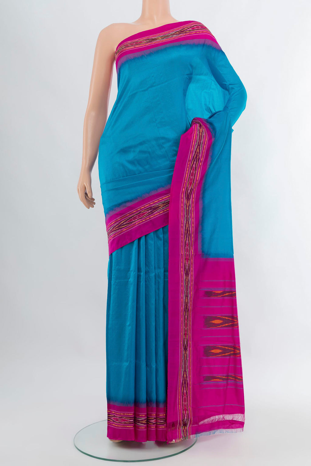 Sky Blue Pochampally Silk Saree with Plain Body and Ikat Border.  displayed on a mannequin