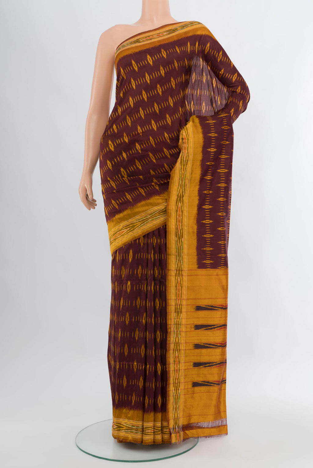 Coffee Brown Pochampally Silk Saree with Ikat design on the body and Ikat Border.  displayed on a mannequin