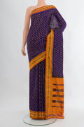 Navy Blue Pochampally Silk Saree with Ikat design on the body and Ikat Border.  displayed on a mannequin