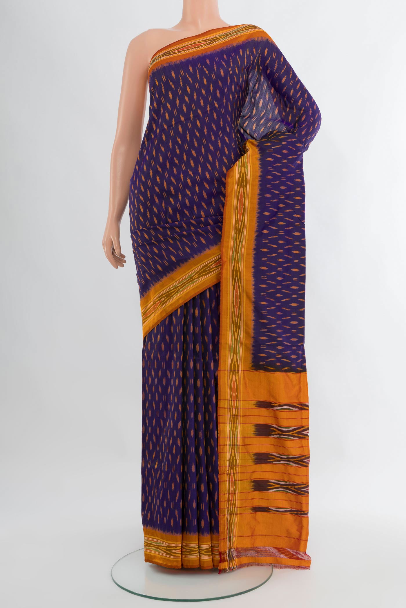 Navy Blue Pochampally Silk Saree with Ikat design on the body and Ikat Border.  displayed on a mannequin