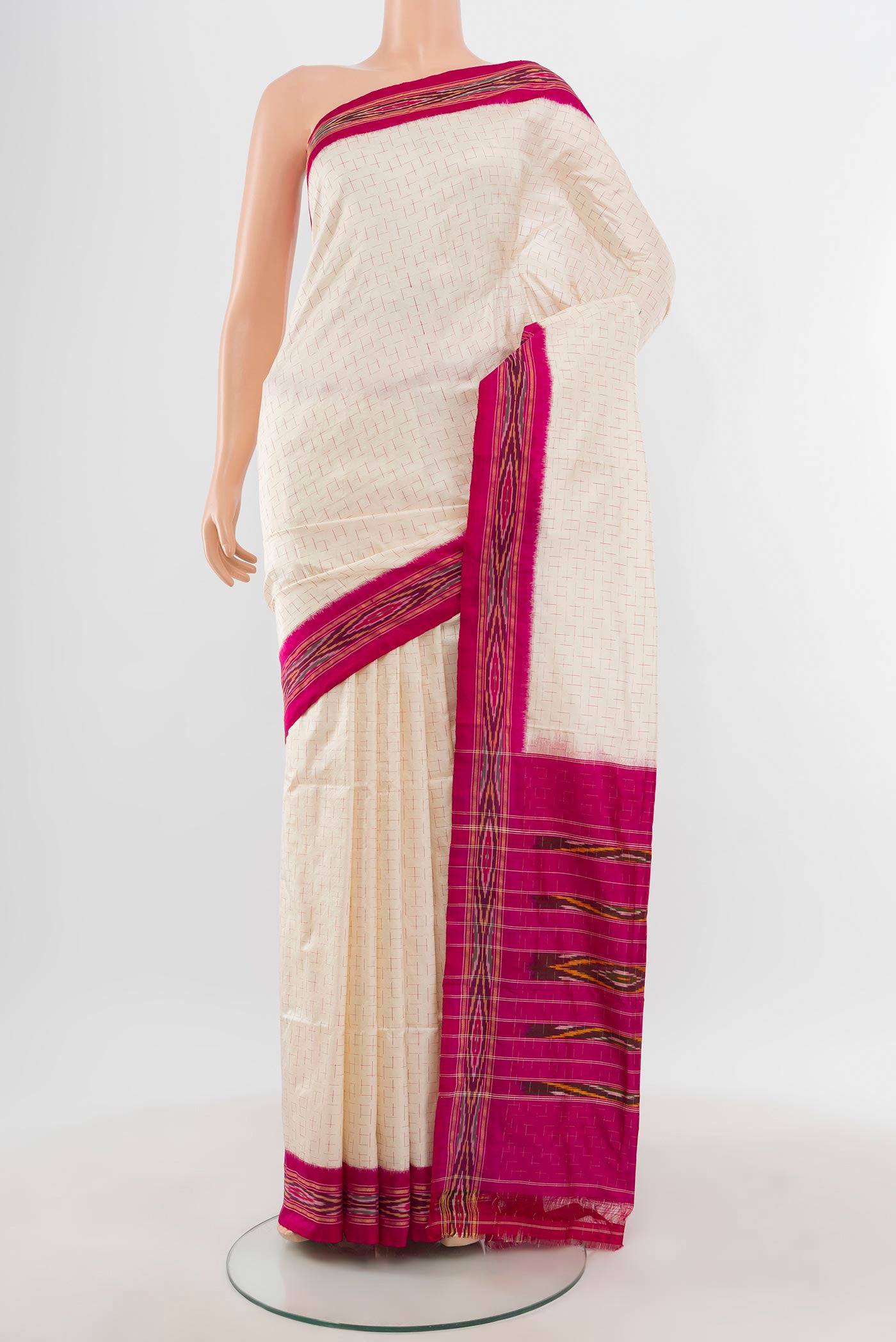 Cream Pochampally Silk Saree with Ikat design on the body and Ikat Border.  displayed on a mannequin