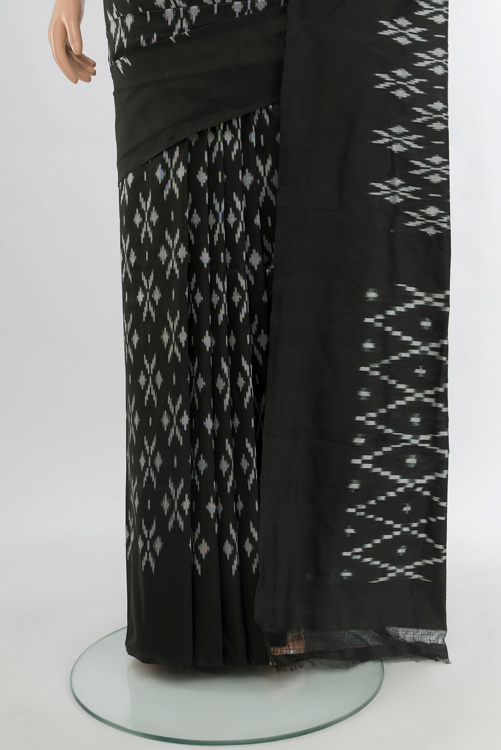 Pleats and pallu of Black Pochampally Silk Saree with Pure Ikat on the body and Plain Border. 