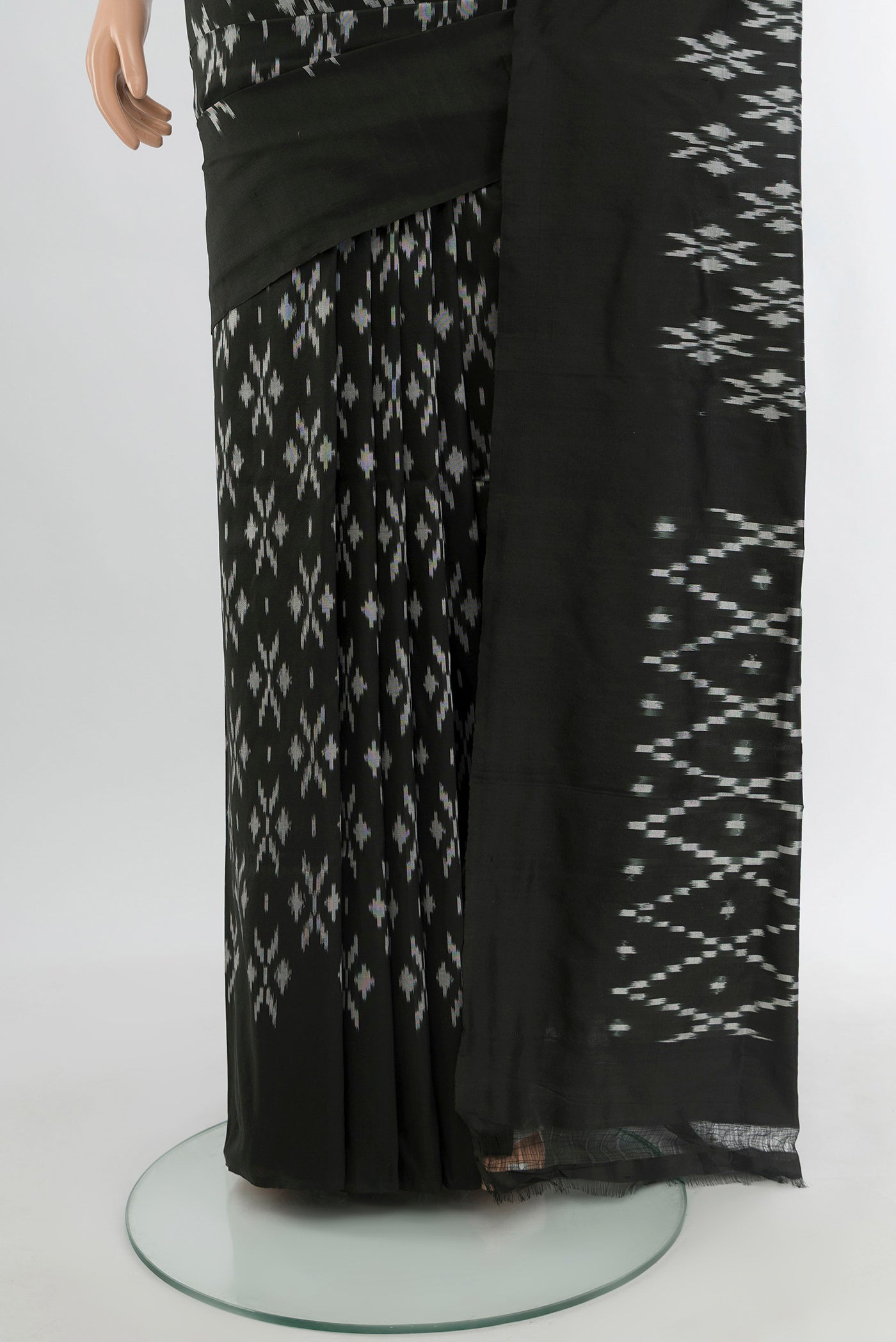 Pleats and pallu of Black Pochampally Silk Saree with Pure Ikat on the body and Plain Border. 