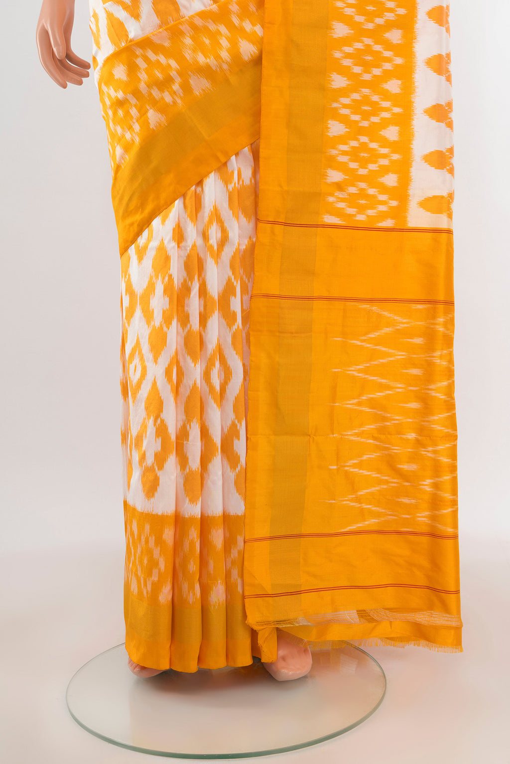 Pleats and pallu of Off White Pochampally Silk Saree with Ikat design on the body and Ikat Border. 