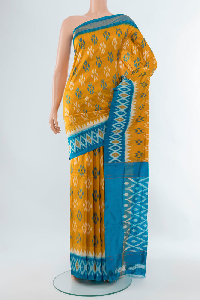 Mustard Pochampally Silk Saree with Ikat Print on the body and Silk Border.  displayed on a mannequin