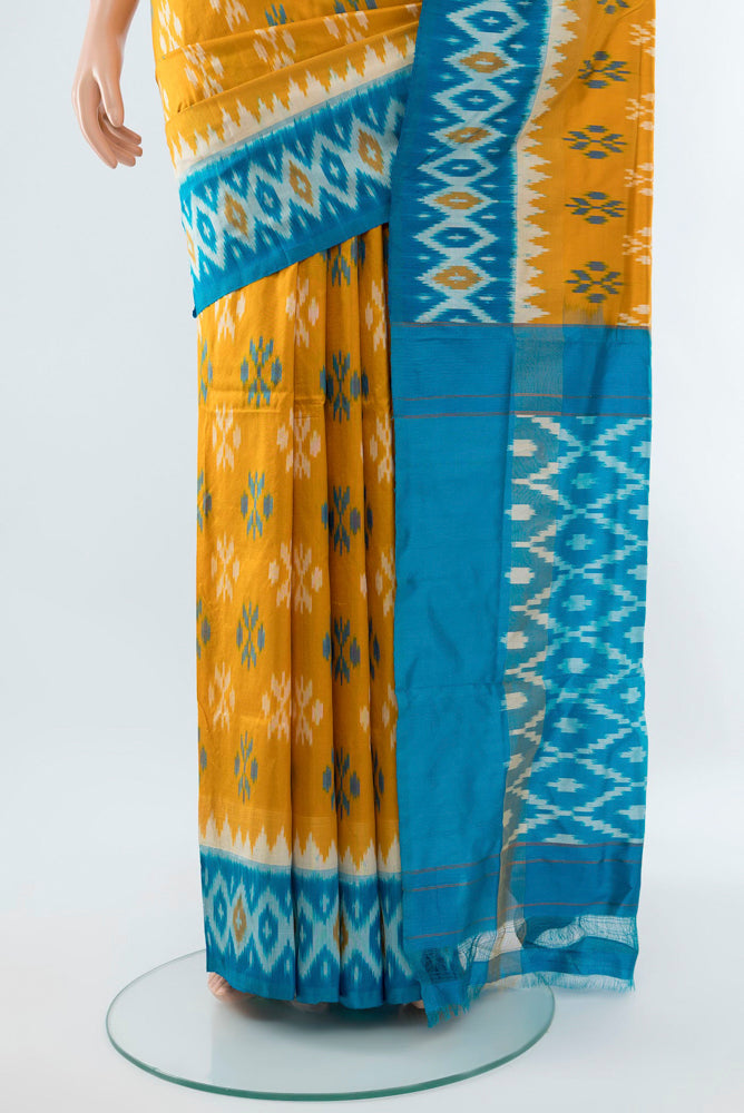 Pleats and pallu of Mustard Pochampally Silk Saree with Ikat Print on the body and Silk Border. 