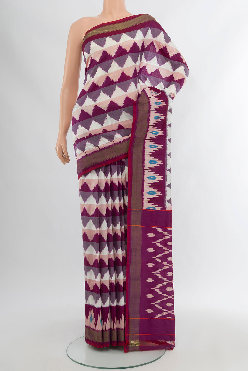 Multi Color Pochampally Silk Saree with Ikat Print on the body and Silk Border.  displayed on a mannequin