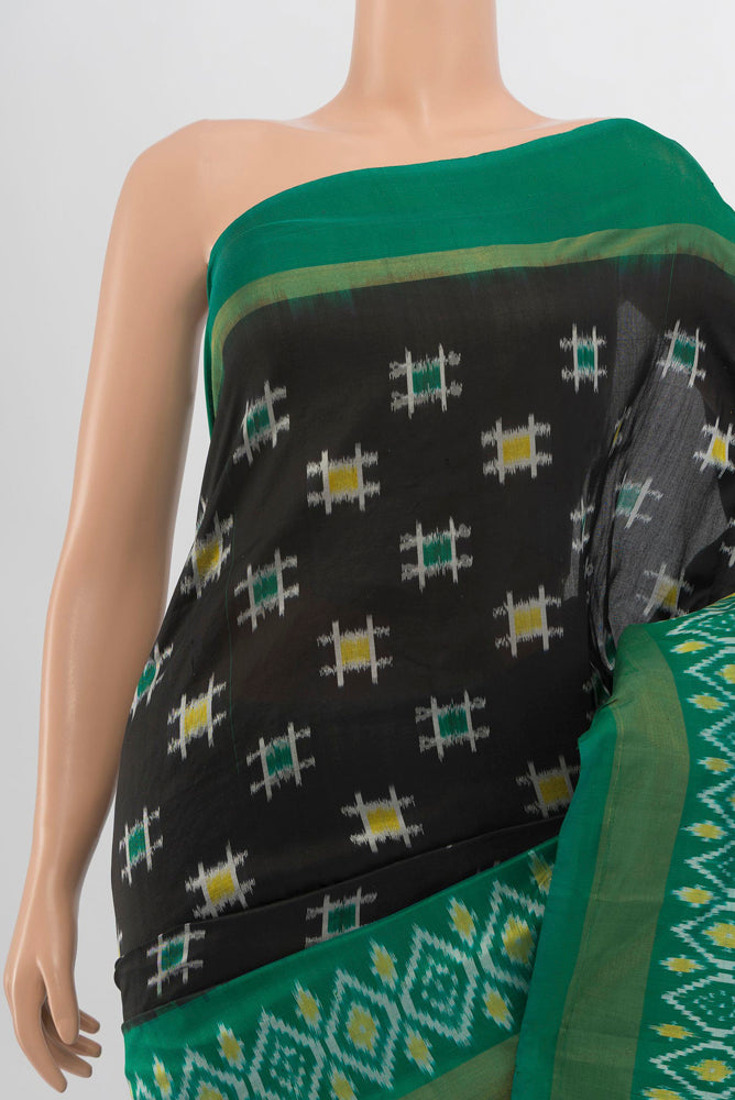 Border image of Black Pochampally Saree with Ikat Print on the body and Silk Border. 