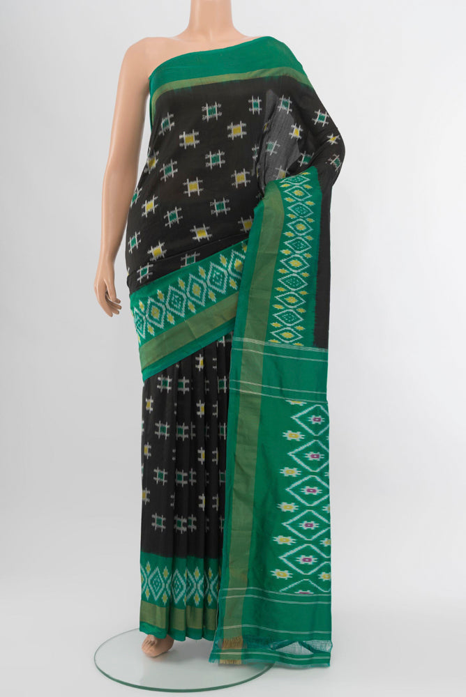 Black Pochampally Saree with Ikat Print on the body and Silk Border.  displayed on a mannequin