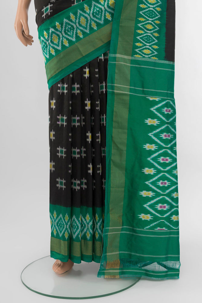 Pleats and pallu of Black Pochampally Saree with Ikat Print on the body and Silk Border. 