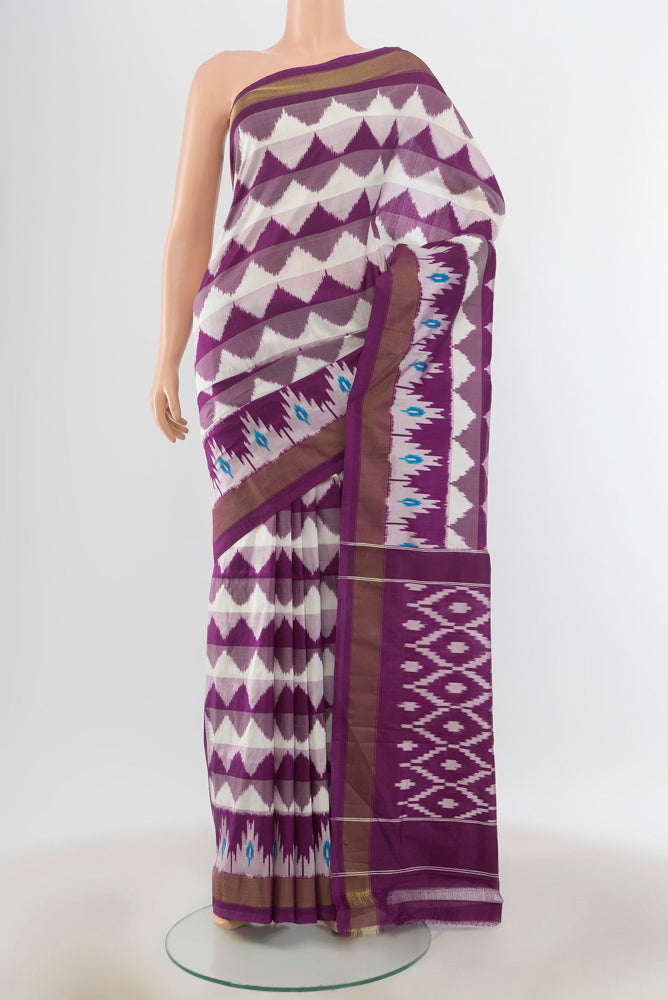 Multi Color Pochampally Saree with Ikat Print on the body and Silk Border.  displayed on a mannequin