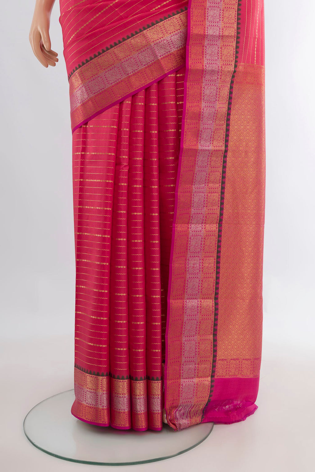 Pleats and pallu of Pure Silk Coral Kanchipuram Saree with Stripes on the body and Zari Border. 