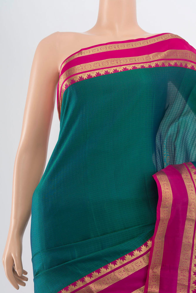 Border image of Peacock Blue Kanchipuram Silk Saree with Zari Butta on the body and Silk Border. 